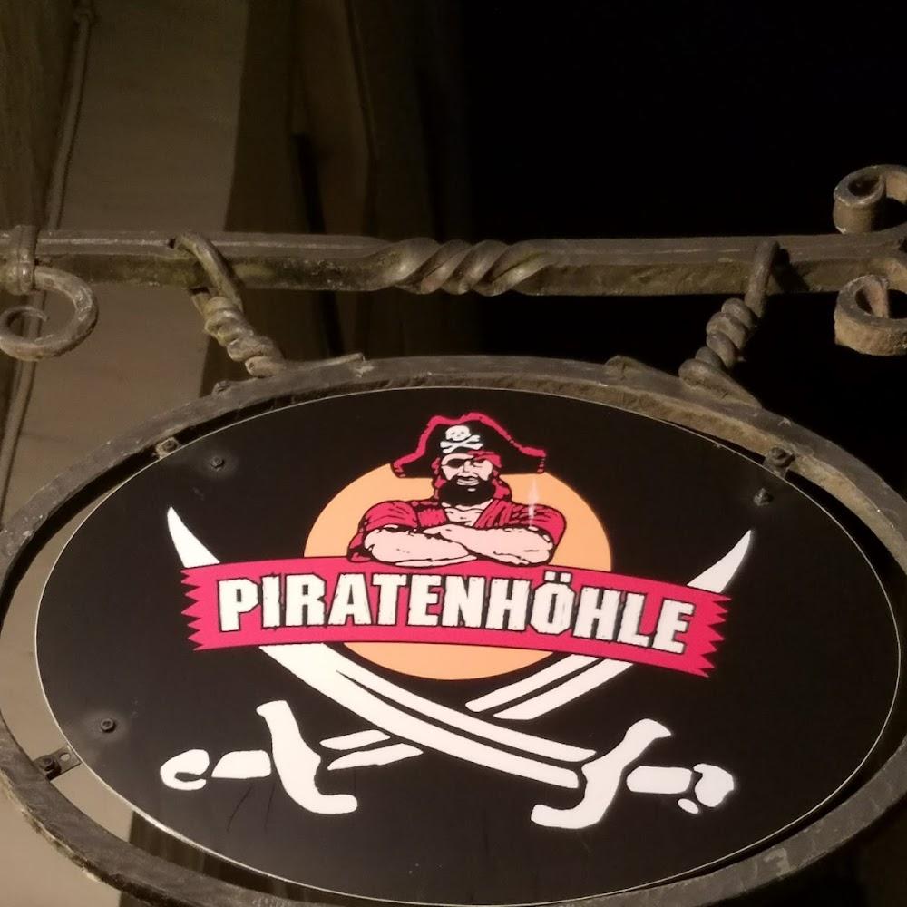 A sign with a pirate and crossed swords. The sign says